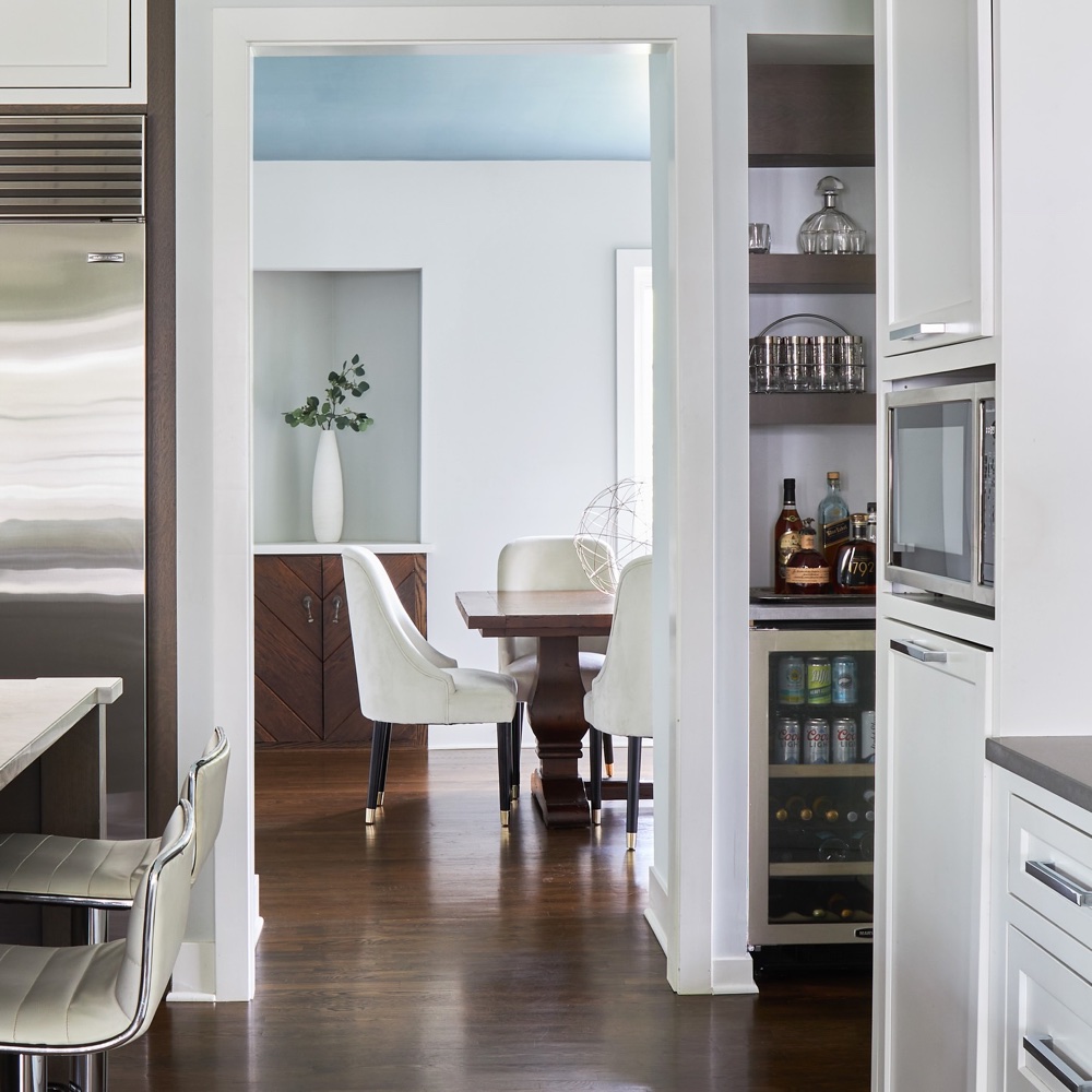Dry bar throughway to dining room, luxury renovation and interior design by Martire Custom Homes